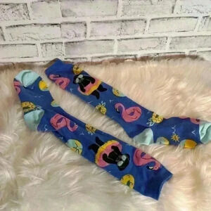 Dog‎ socks floating in pool with floatie pink flamingo float